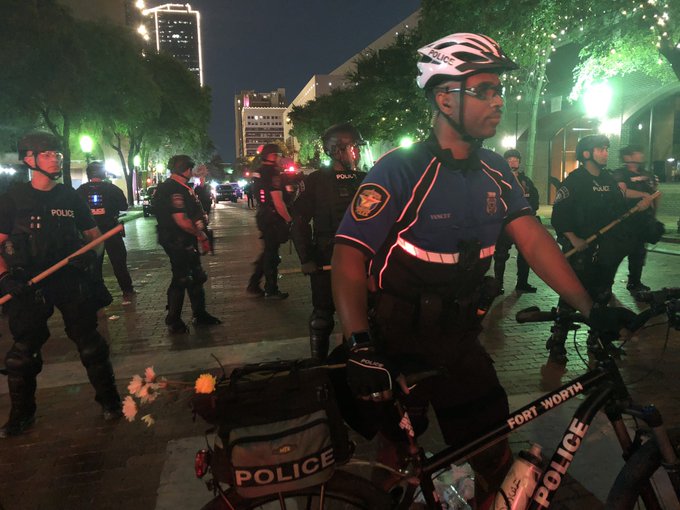 Fort Worth march ends peacefully after curfew when police kneel, pray with protesters
