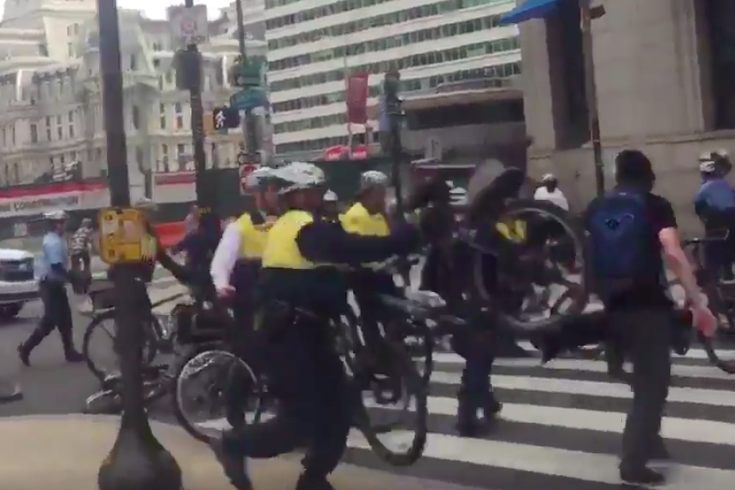 Philly police investigating officer who swung bicycle at protester