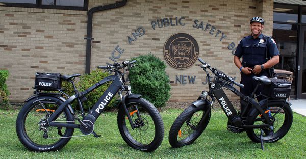 Easy riding for these bike cops. Their new wheels can go 50 mph.