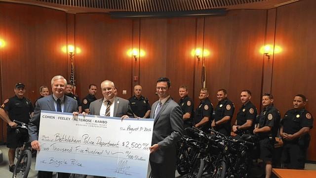Former Bethlehem chief delivers check to old police unit