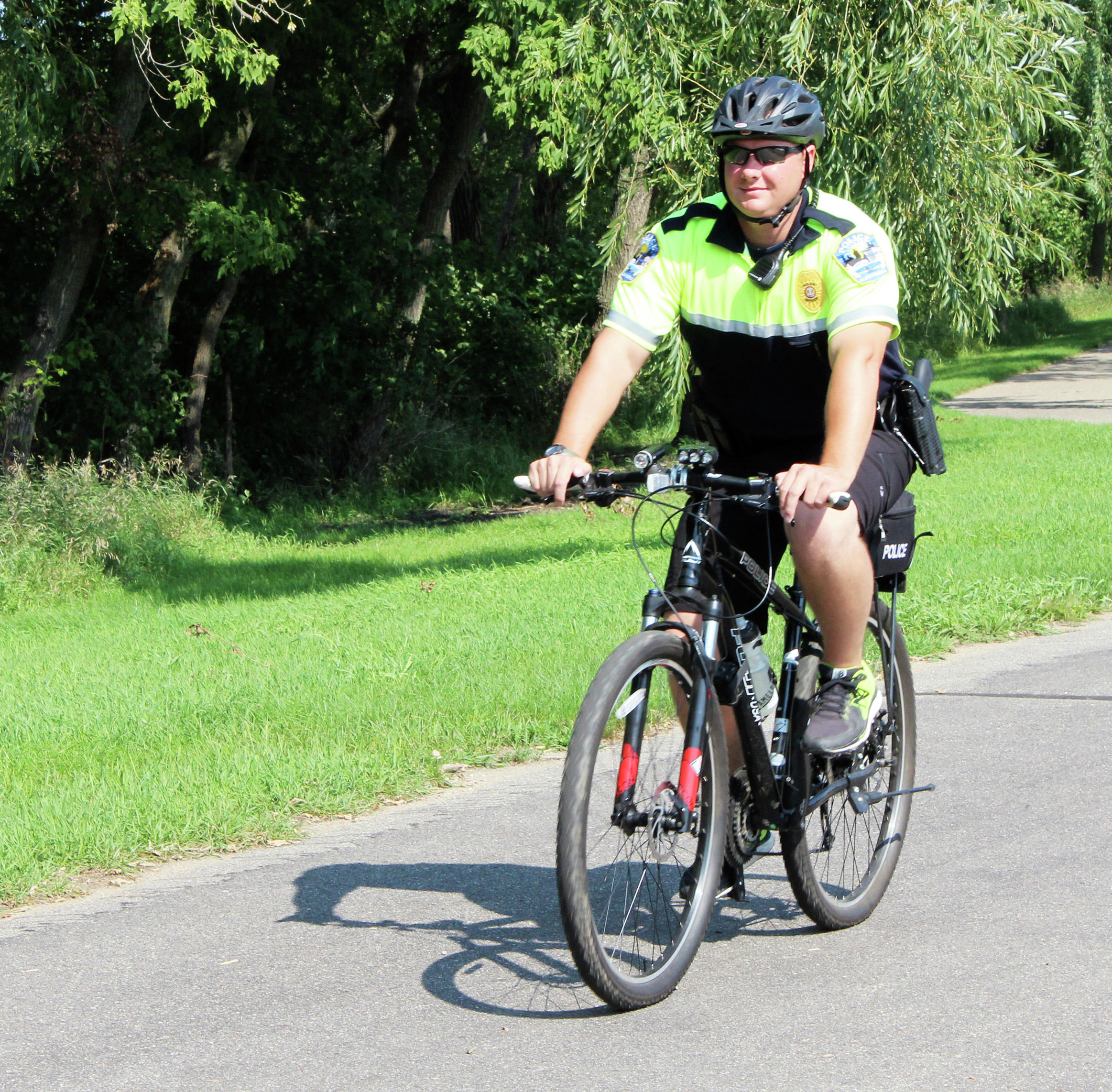Police with pedals promote safety on bike trail