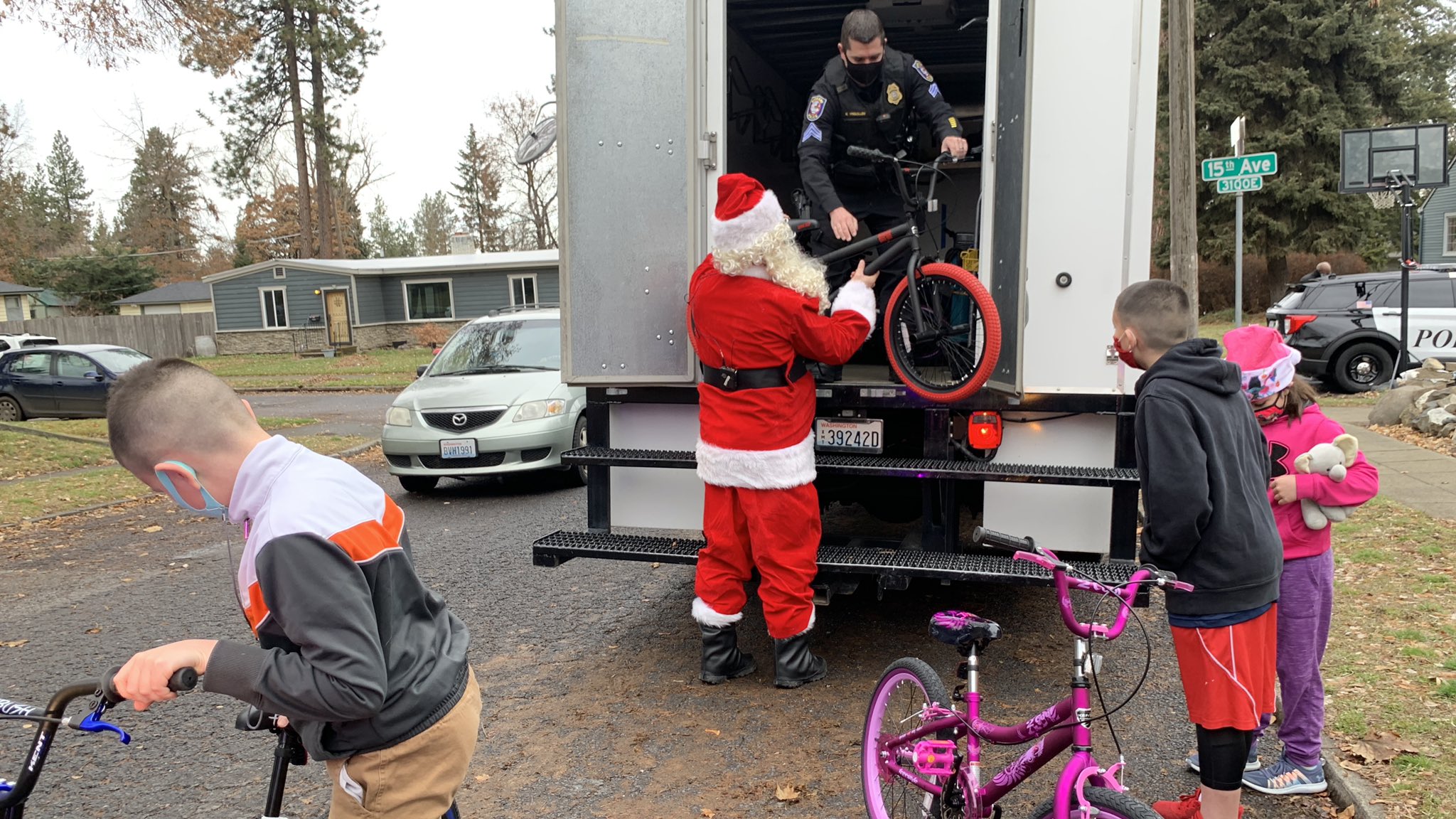 Spokane Police, Santa surprise local kids with new bikes for Christmas